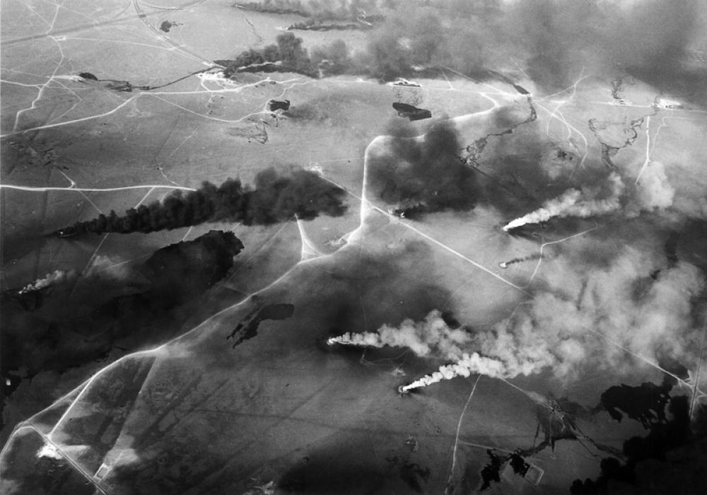 Aerial view of oil wells on fire in the Gulf War free photo Aerial view of oil wells on fire in the Gulf War free photo