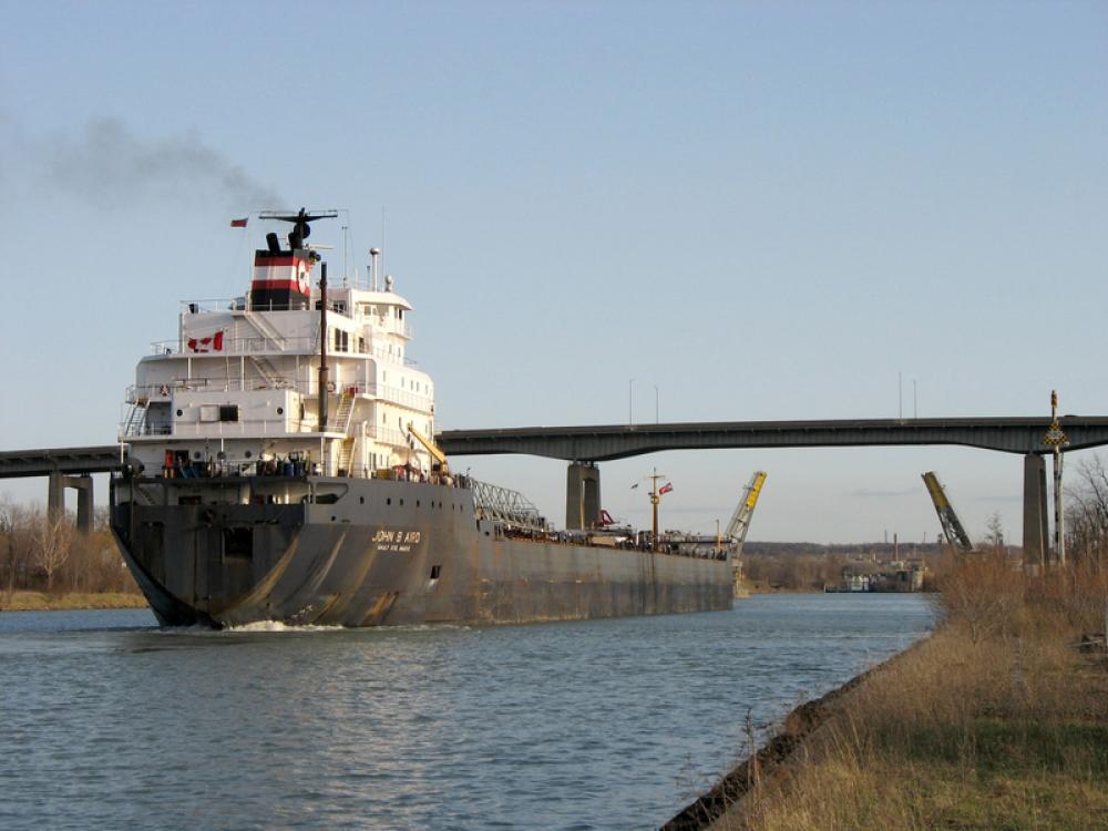 Lake freighter John B. Aird traversing the Welland Canal in St. Catharines, Ontario, Canada free photo Lake freighter John B. Aird traversing the Welland Canal in St. Catharines, Ontario, Canada free photo