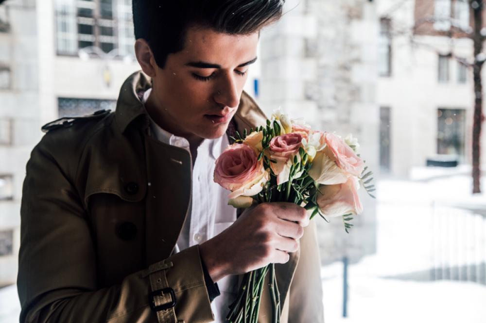 Man Smelling Roses on Valentine's Day free photo Man Smelling Roses on Valentine's Day free photo