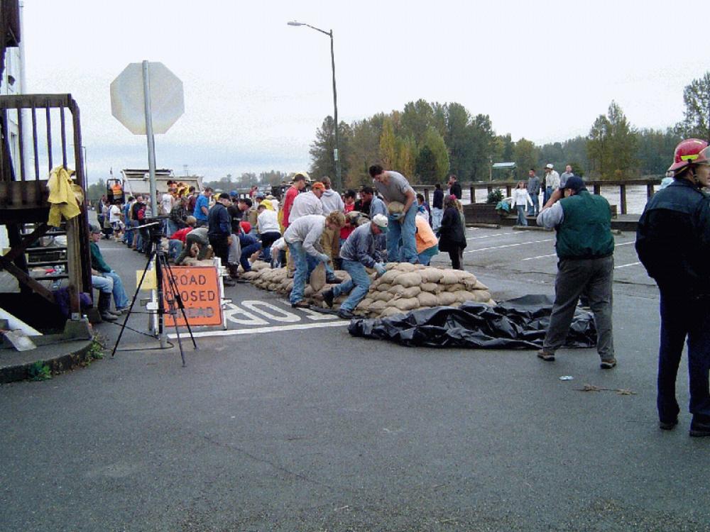 People Building a Dike from sandbags on the Skagit River in Mount Vernon, Washington free photo People Building a Dike from sandbags on the Skagit River in Mount Vernon, Washington free photo