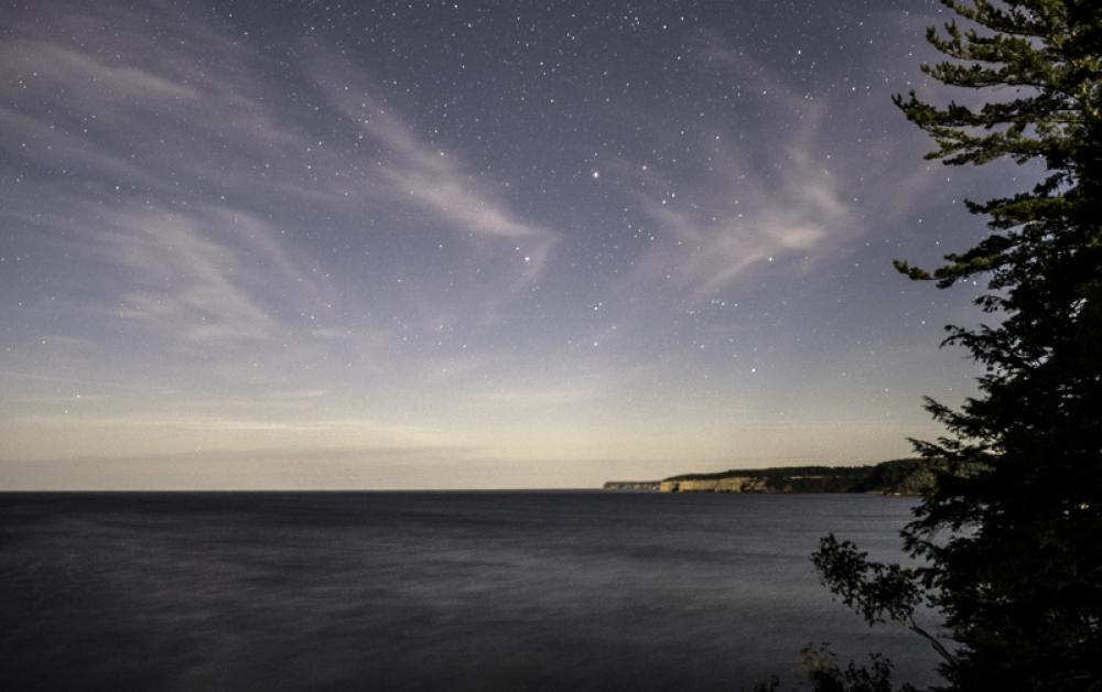 Stars above the night landscape at Pictured Rocks National Lakeshore, Michigan free photo Stars above the night landscape at Pictured Rocks National Lakeshore, Michigan free photo