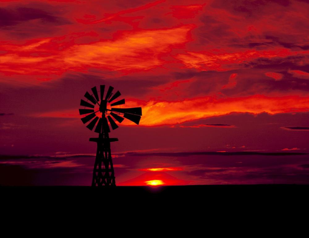 Windmill in the landscape with red skies in Texas free photo Windmill in the landscape with red skies in Texas free photo