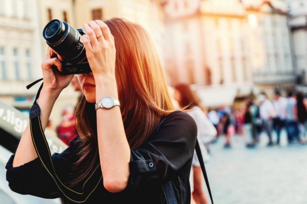 Young Tourist Woman Doing A Photo In The City 