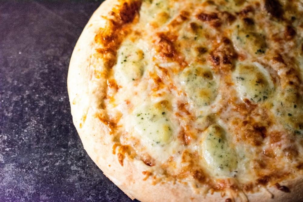 Homemade pizza black background Homemade pizza black background