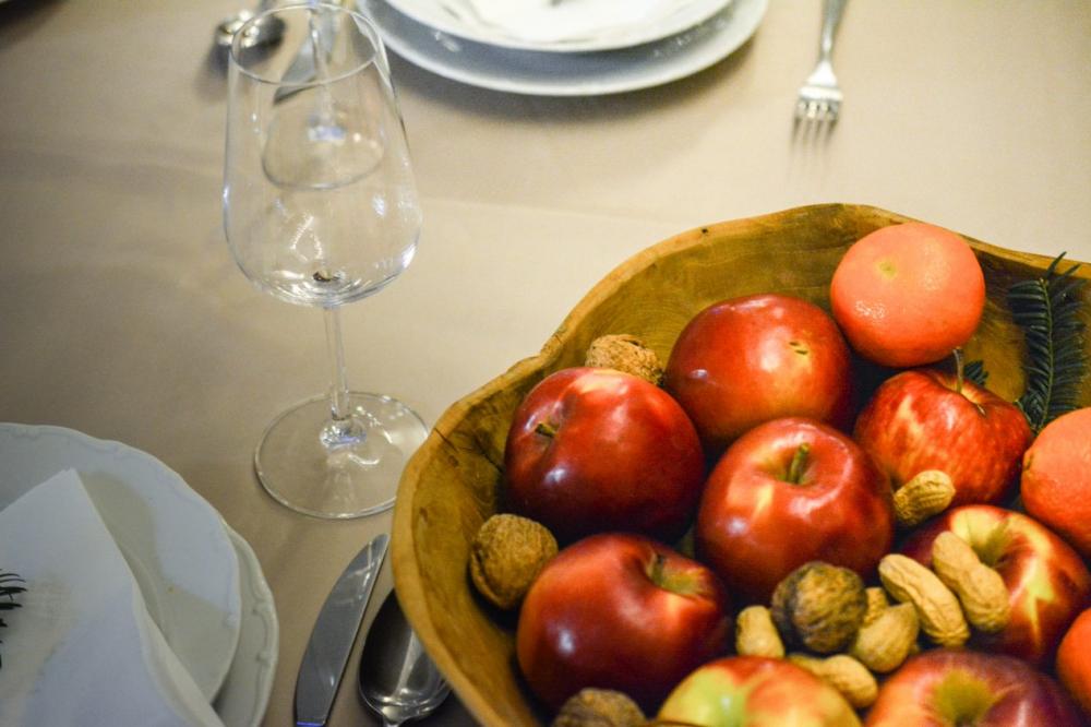 Fruit and wine glass on christmas table Fruit and wine glass on christmas table