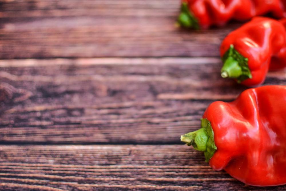 Red peppers on wood Red peppers on wood
