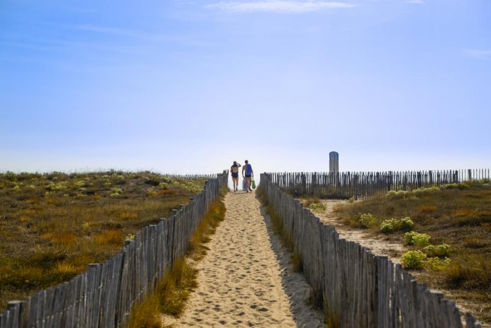 People walking to the beach People walking to the beach