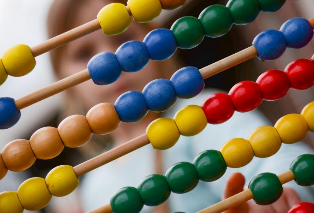 Child with abacus | Image Finder