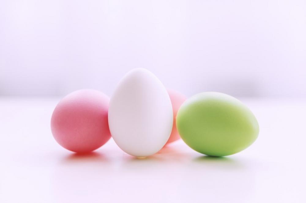 Happy Easter! Colorful Easter eggs on white table. Happy Easter! Colorful Easter eggs on white table.