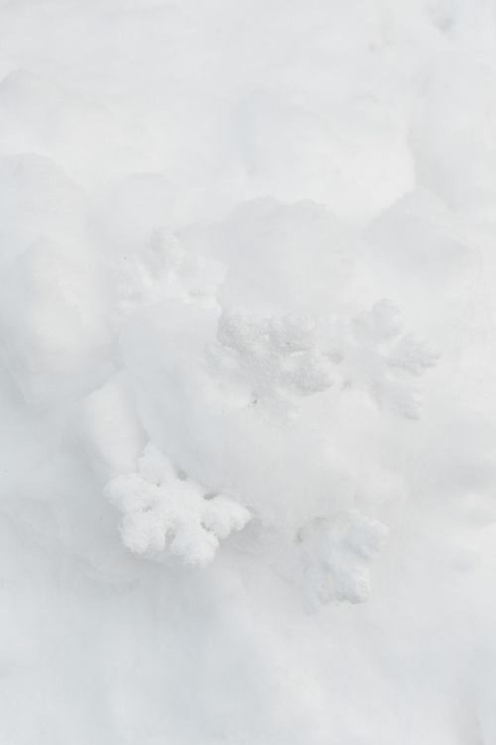 Decorative snowflakes on fresh snow Decorative snowflakes on fresh snow