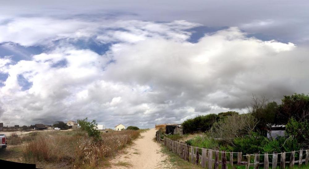 road sand fence clouds sky road sand fence clouds sky
