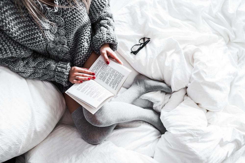 Relaxed Woman Reading in Bed Relaxed Woman Reading in Bed
