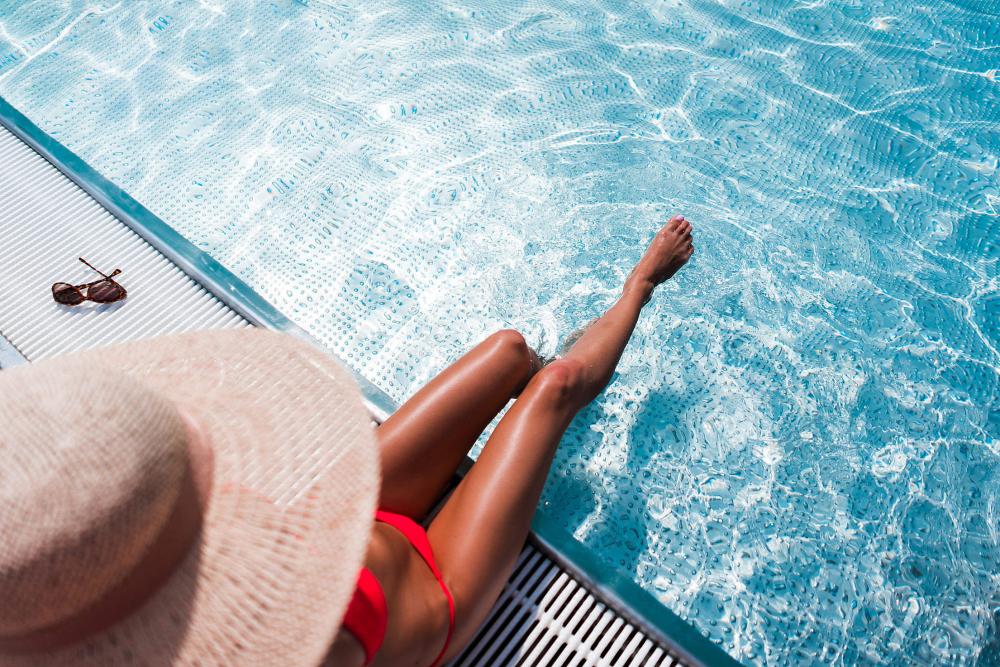 Beautiful Bikini Woman Relaxing by the Luxury Pool Beautiful Bikini Woman Relaxing by the Luxury Pool