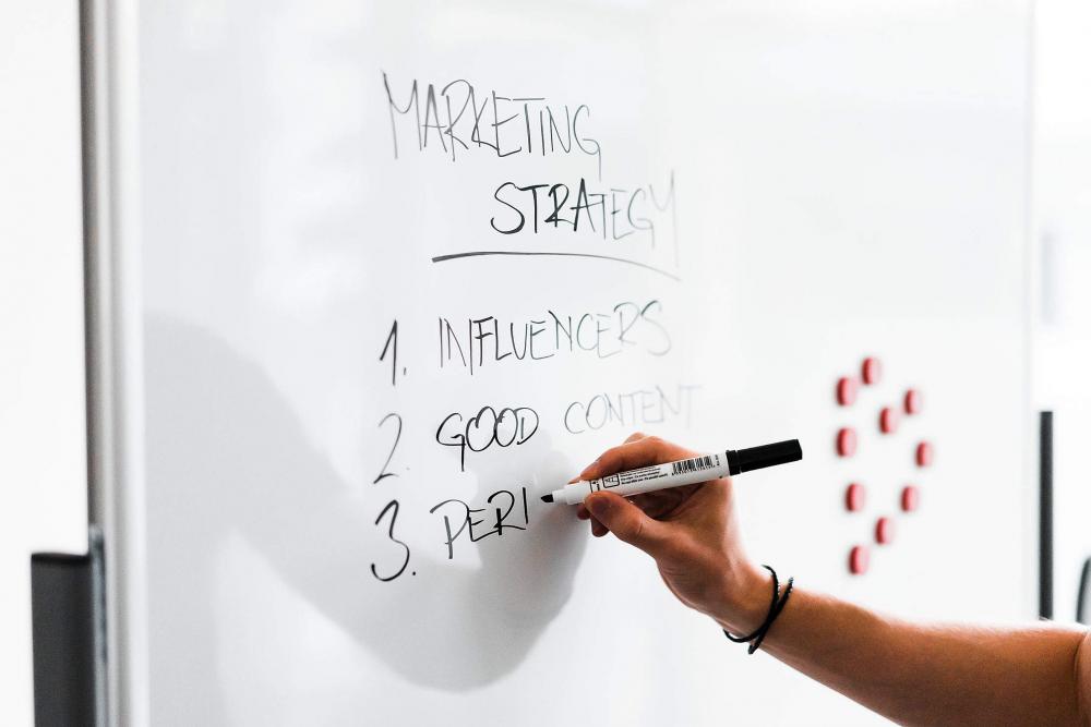 Team Leader Writing On White Board 