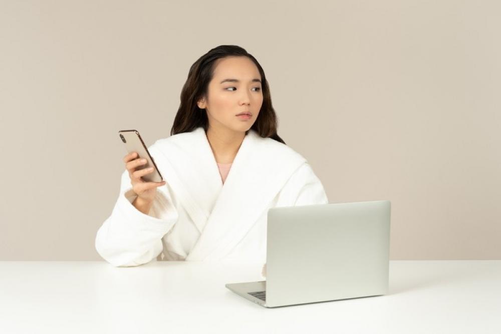 Young Asian Woman Using Phone And Doing Online Shopping Young Asian Woman Using Phone And Doing Online Shopping