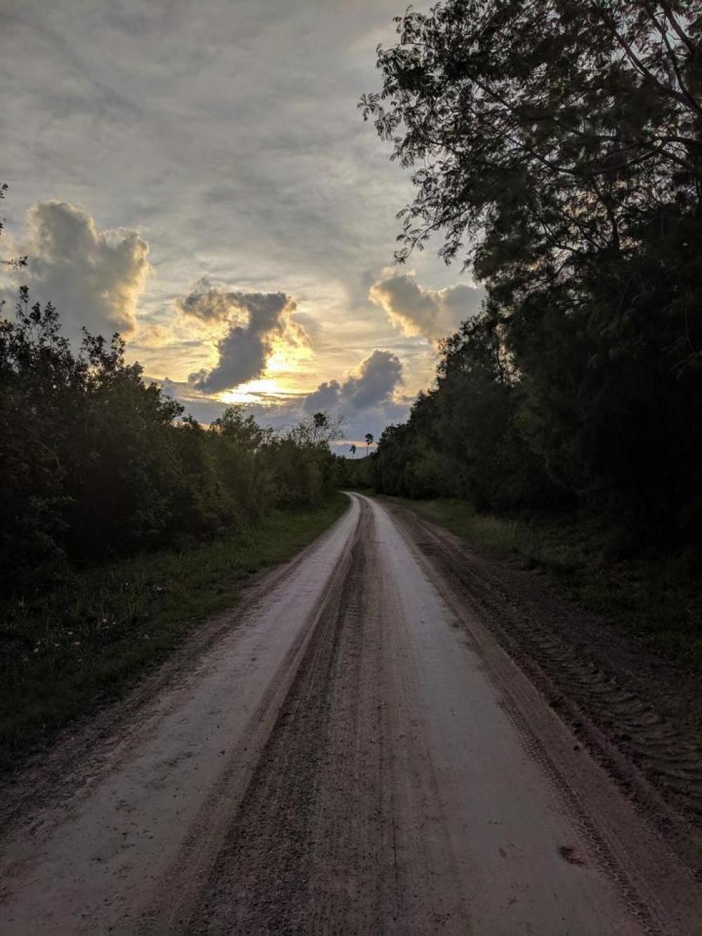 road curve sky sunset hard pack road curve sky sunset hard pack