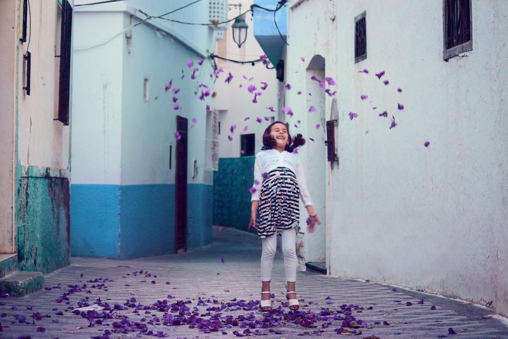 Girl playing with Flowers Girl playing with Flowers