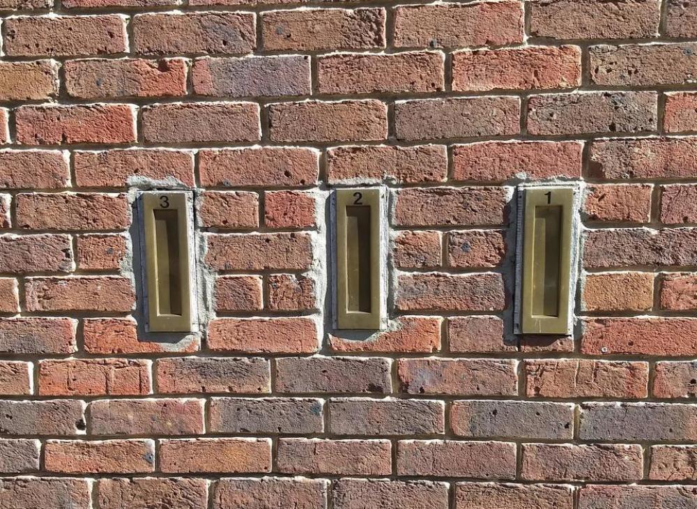 letter boxes three brass brick wall letter boxes three brass brick wall