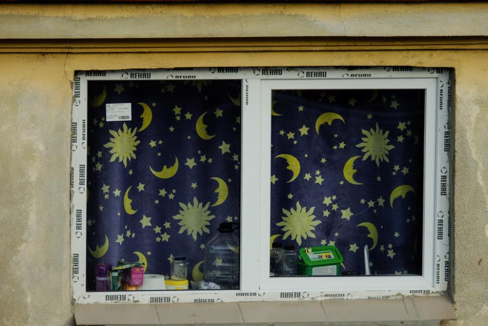 Closeup on a Window with Blue Night Curtains Closeup on a Window with Blue Night Curtains