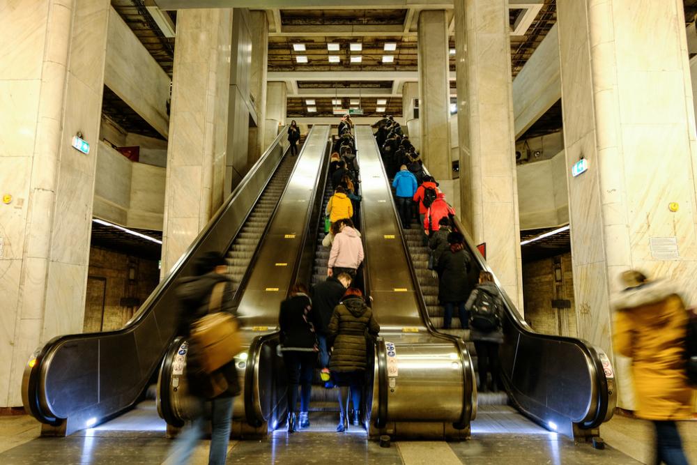 People Standing on Automatic Stairs People Standing on Automatic Stairs