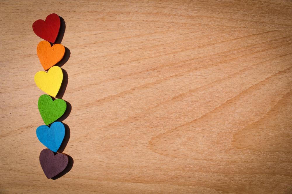 Little Rainbow Painted Hearts Stacked On Top Of Each Other Photo Little Rainbow Painted Hearts Stacked On Top Of Each Other Photo