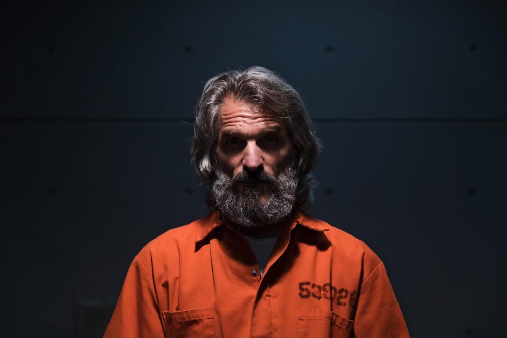 Prisoner Sat In A Dark Room Photo Prisoner Sat In A Dark Room Photo