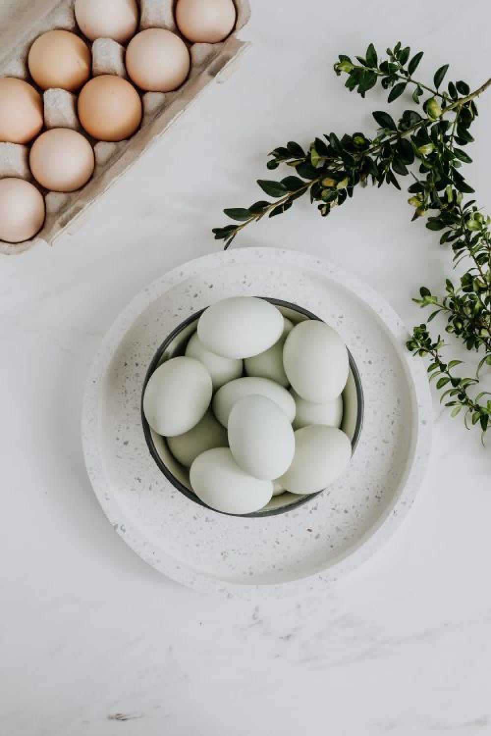 Easter flat lay with eggs on a white marble Easter flat lay with eggs on a white marble