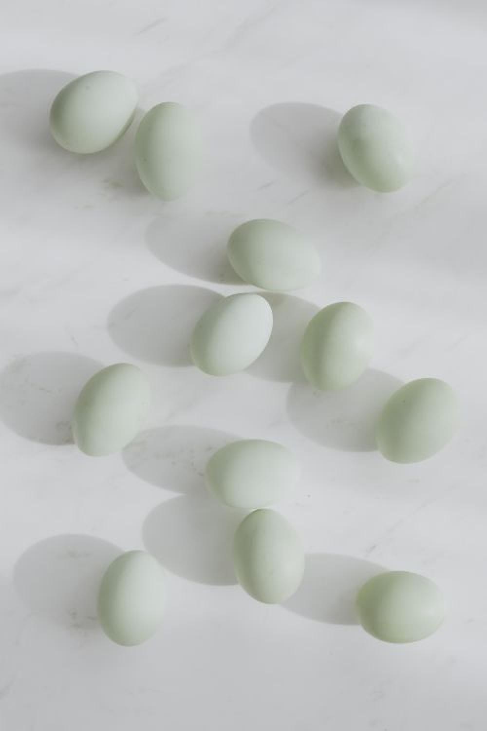 Easter flat lay with eggs on a white marble Easter flat lay with eggs on a white marble