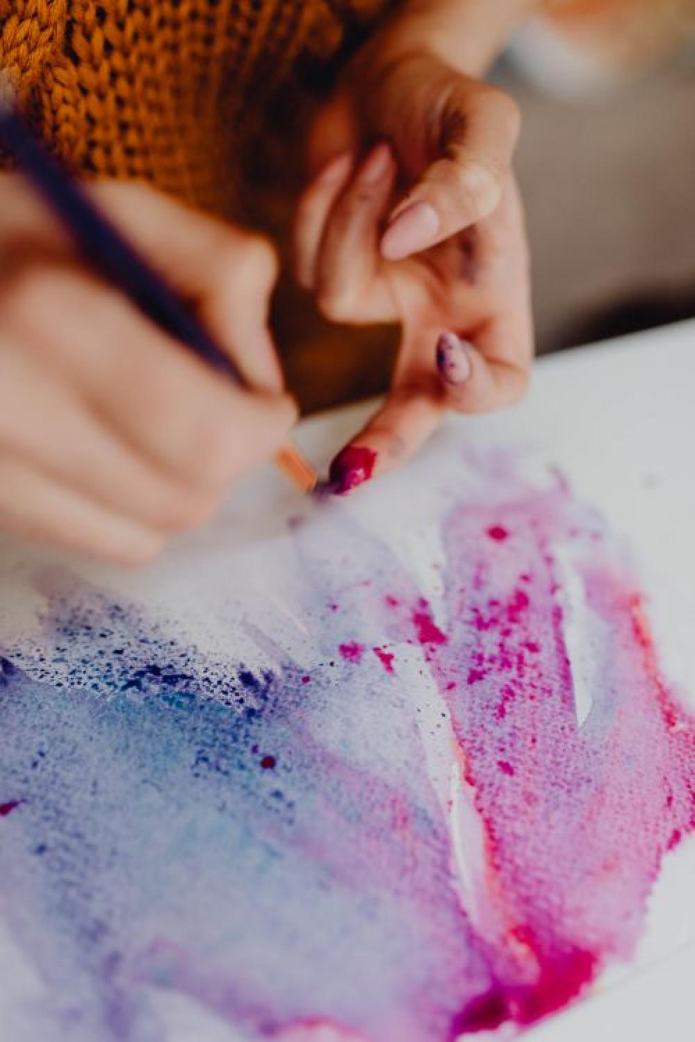 A woman paints with watercolors A woman paints with watercolors
