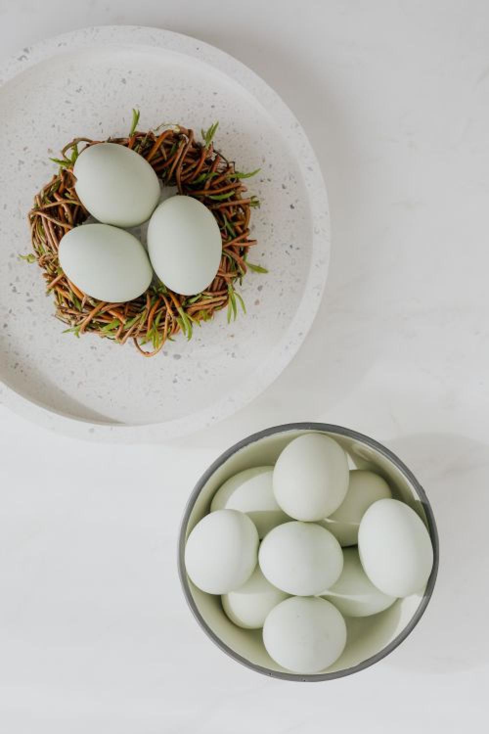 Easter flat lay with eggs on a white marble Easter flat lay with eggs on a white marble