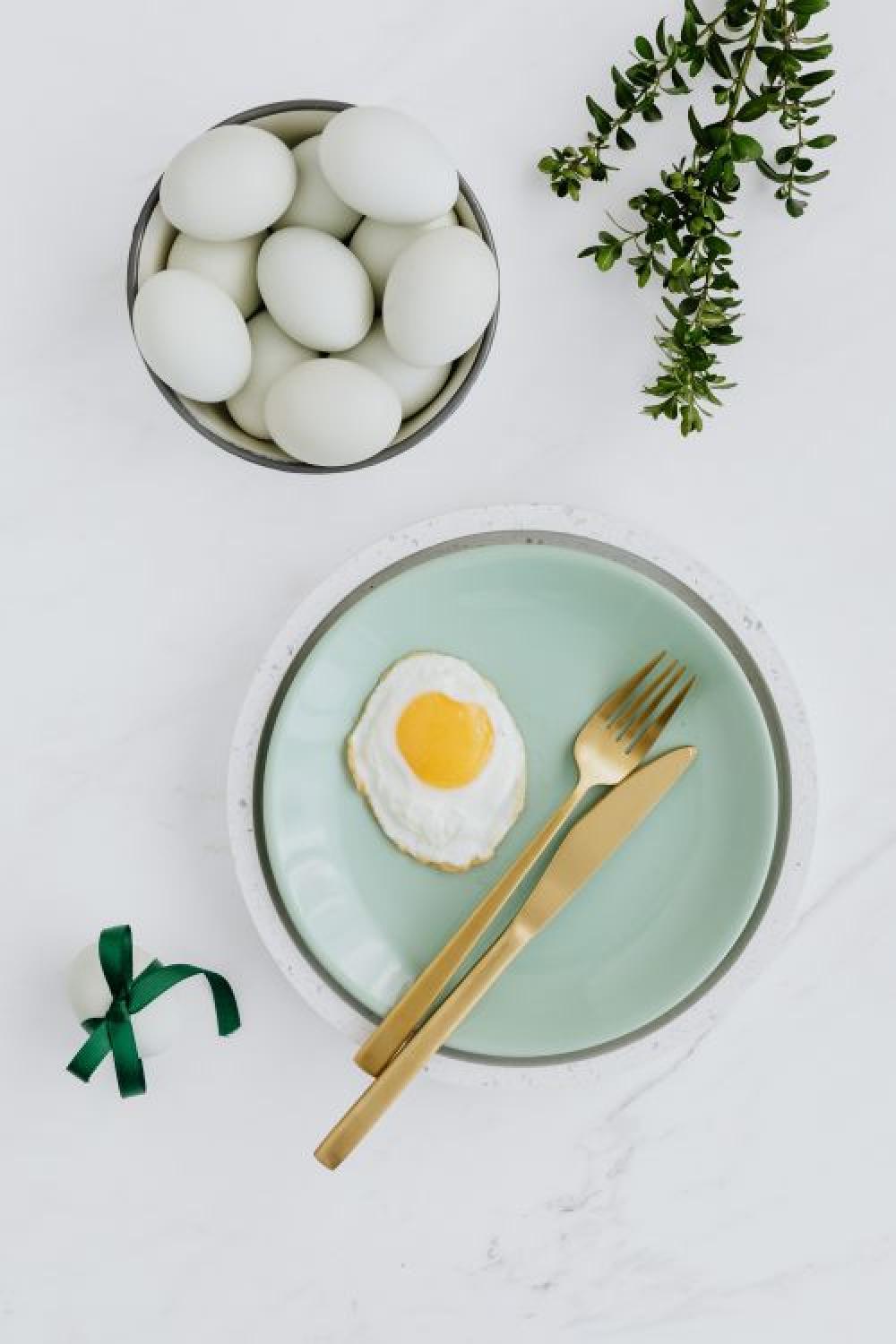 Easter flat lay with eggs on a white marble Easter flat lay with eggs on a white marble