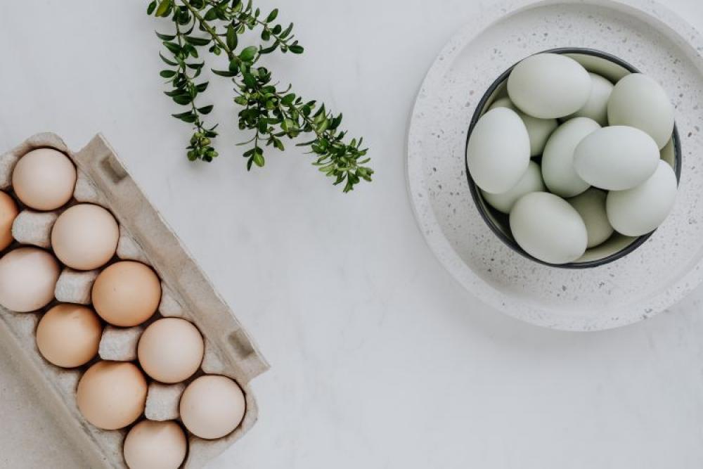 Easter flat lay with eggs on a white marble Easter flat lay with eggs on a white marble