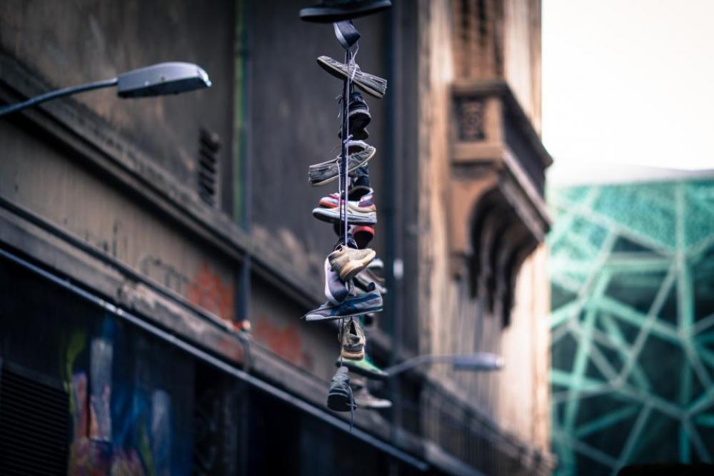 shoes skewered. stacked building lamp posts shoes skewered. stacked building lamp posts