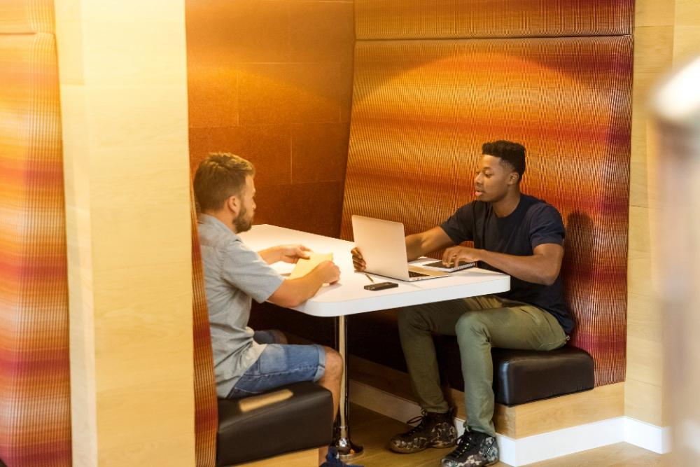 meeting booth discussion man laptop meeting booth discussion man laptop