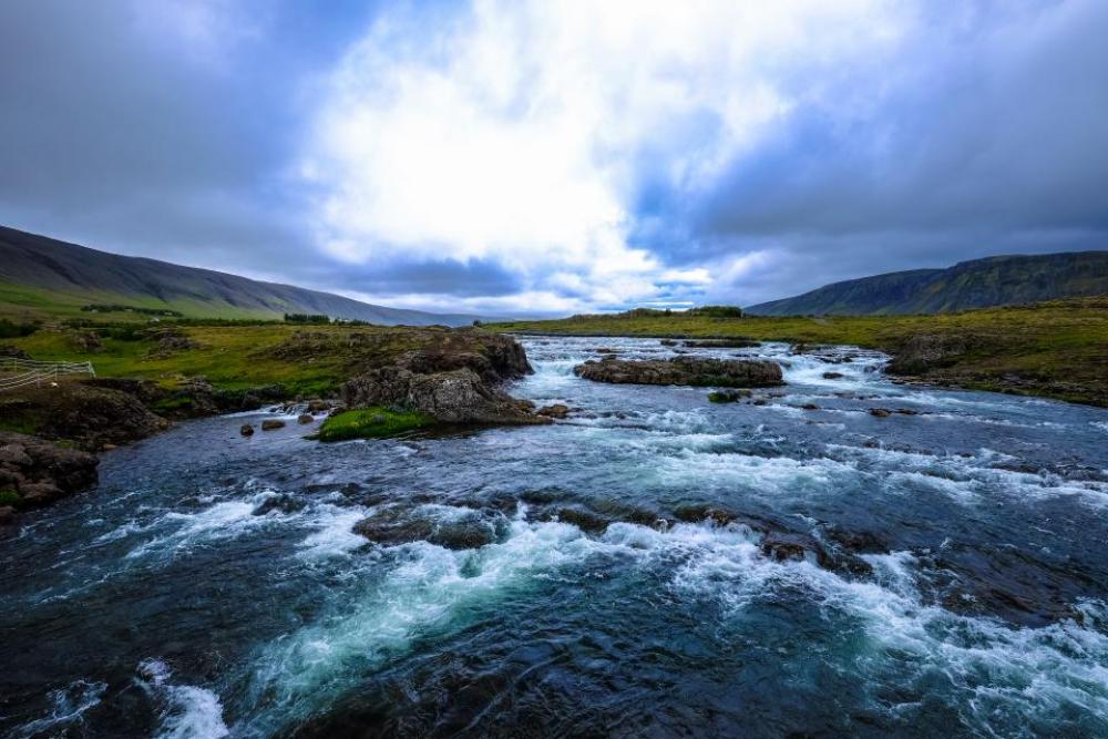 river water rocks green grass river water rocks green grass