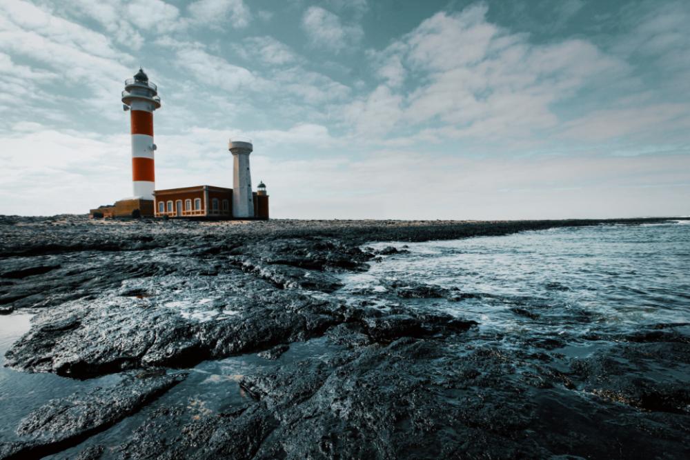 lighthouse sea day ocean water lighthouse sea day ocean water