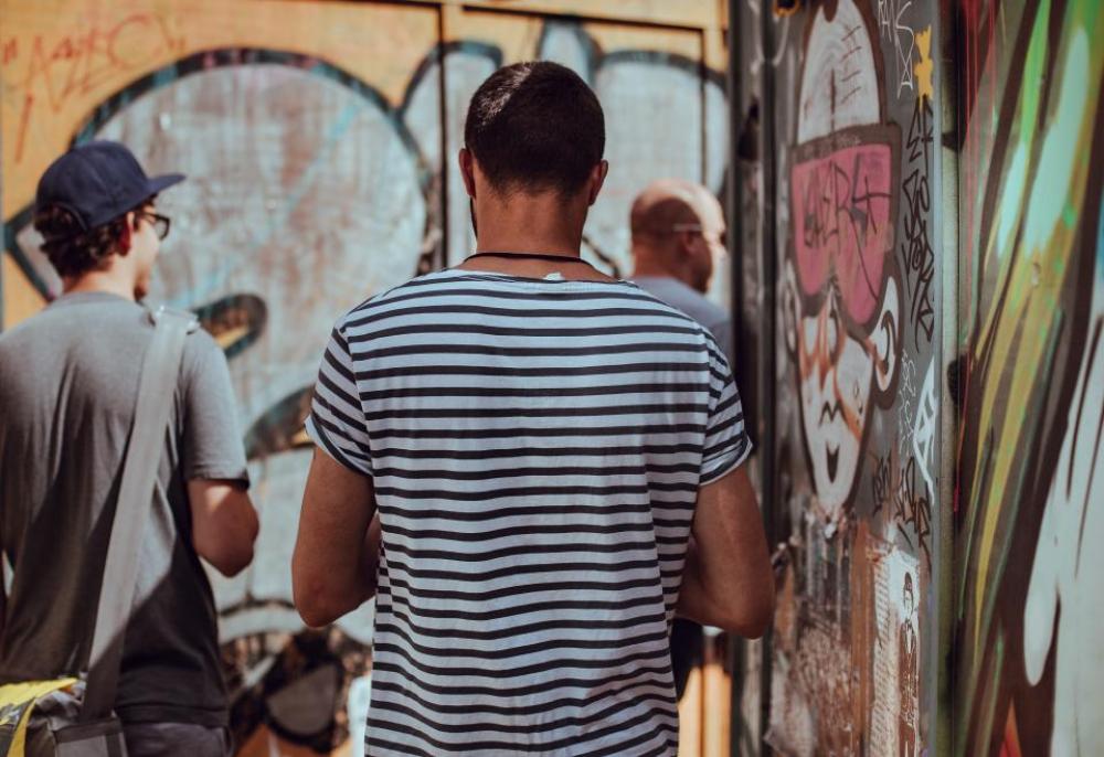 people back men guys walking people back men guys walking