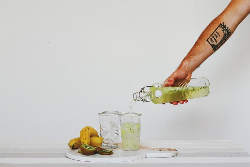 hand glass bottle water juice hand glass bottle water juice
