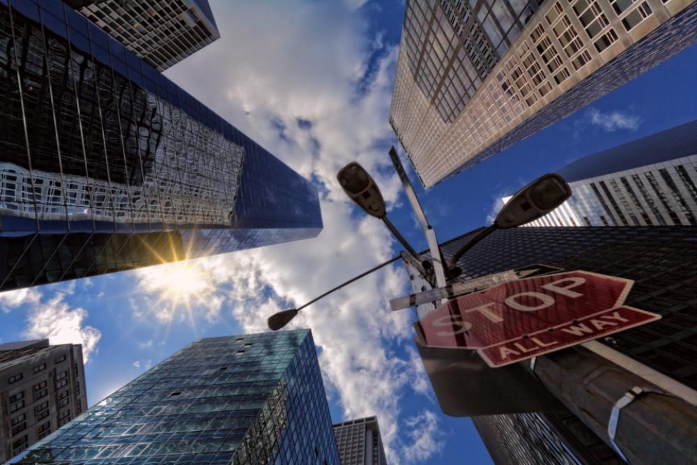 stop sign city skyscraper blue sky stop sign city skyscraper blue sky