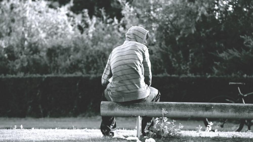 black and white people guy sitting waiting black and white people guy sitting waiting