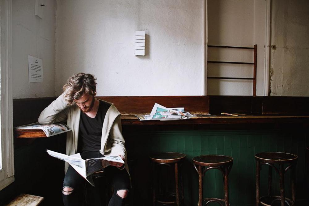 thinking people man reading magazine thinking people man reading magazine