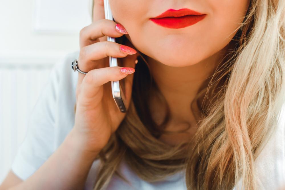 woman holding mobile device phone woman holding mobile device phone