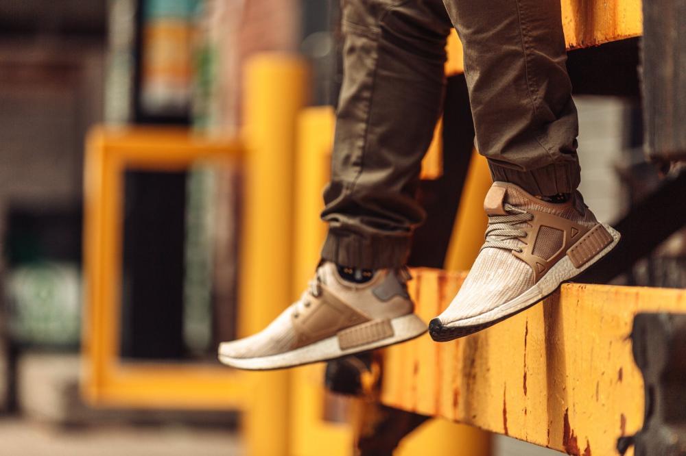 Beige Trainers In Front Of Yellow Beam Photo Beige Trainers In Front Of Yellow Beam Photo