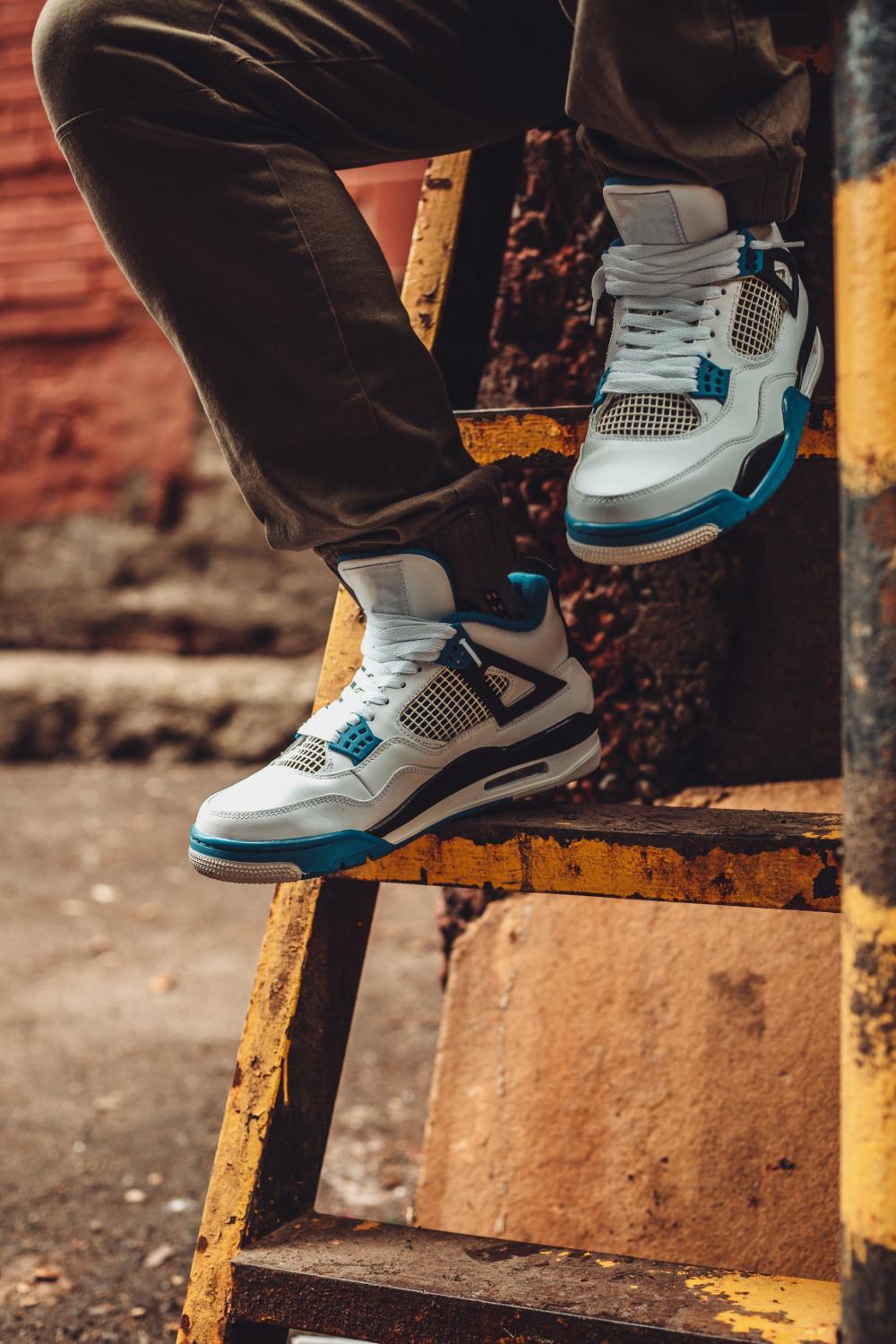 Sitting On Ladder Wearing Sneakers Photo Sitting On Ladder Wearing Sneakers Photo
