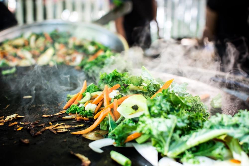 Grilling vegetables at street food market Grilling vegetables at street food market
