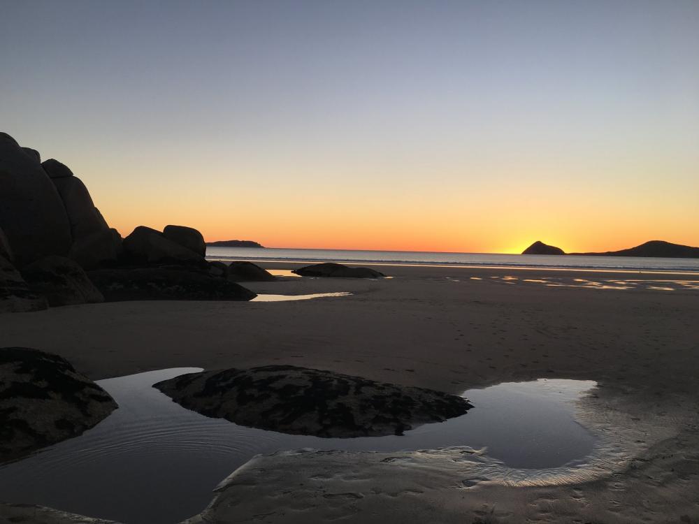 Puddles Of Water On the Beach Reflect The Sunset Photo Puddles Of Water On the Beach Reflect The Sunset Photo