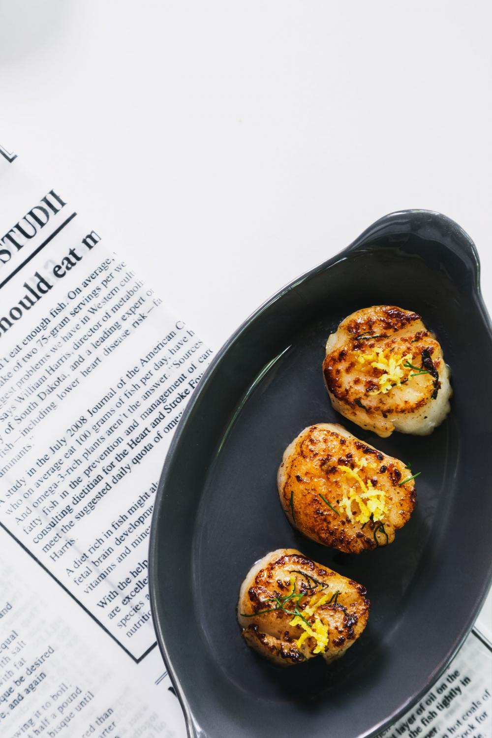 Three Scallops In A Dish Photo Three Scallops In A Dish Photo