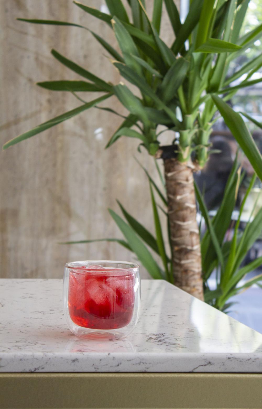 A Glass Tumbler Of Juice On A Marble Counter Photo A Glass Tumbler Of Juice On A Marble Counter Photo