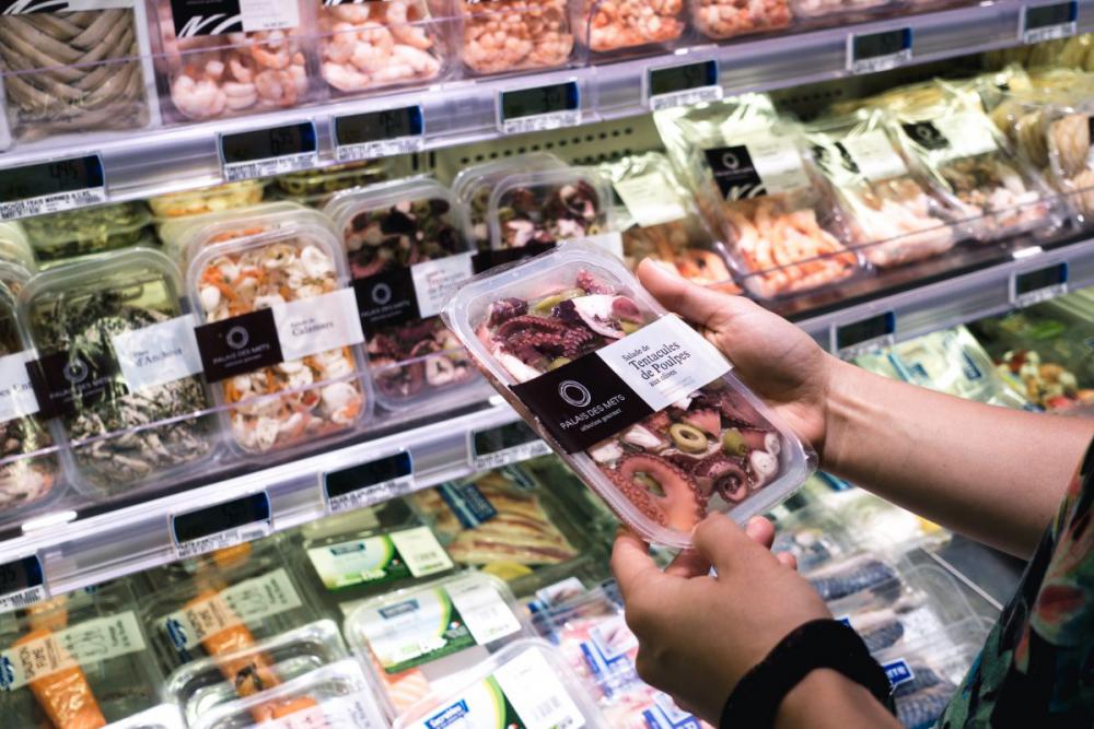 Buying packed seafood at a grocery store Buying packed seafood at a grocery store