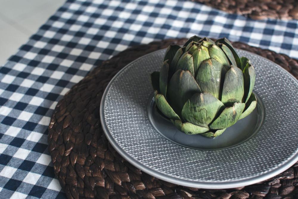 Fresh artichoke in a kitchen Fresh artichoke in a kitchen